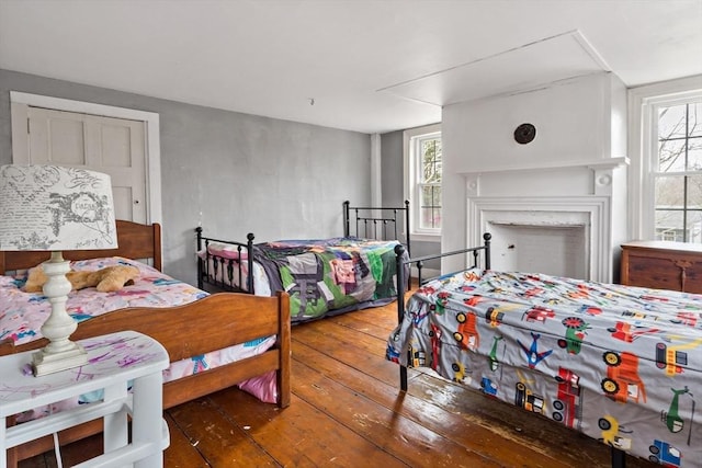 bedroom with hardwood / wood-style flooring