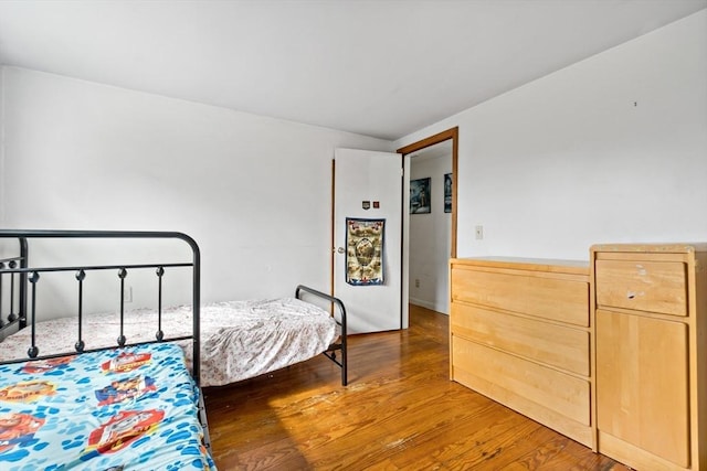 bedroom featuring wood finished floors