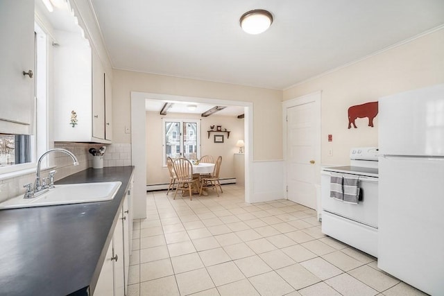 kitchen featuring light tile patterned flooring, sink, white appliances, decorative backsplash, and white cabinets