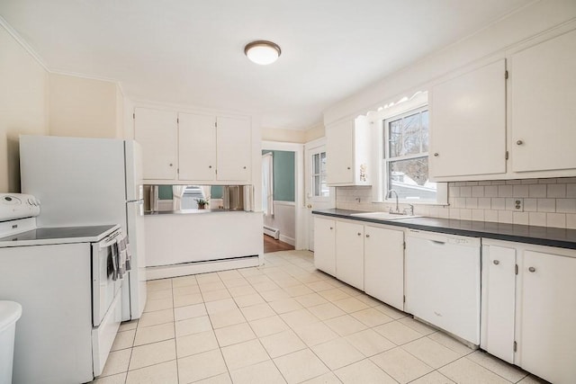 kitchen with washer / dryer, sink, white cabinets, a baseboard heating unit, and white appliances