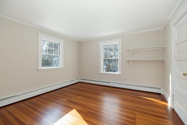 unfurnished room featuring crown molding, hardwood / wood-style flooring, and a baseboard radiator