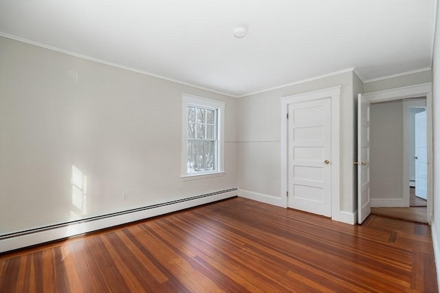 unfurnished room with dark wood-type flooring, ornamental molding, and a baseboard heating unit