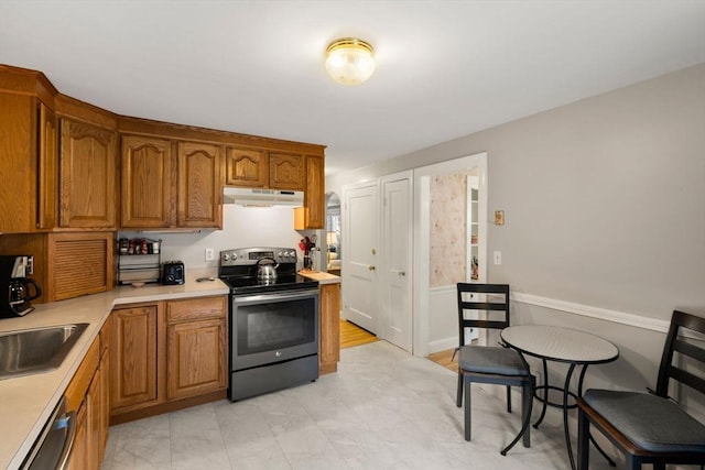 72 Lyall St, Boston, MA 02132 - kitchen featuring stainless steel appliances, under cabinet range hood, light countertops, and brown cabinetry