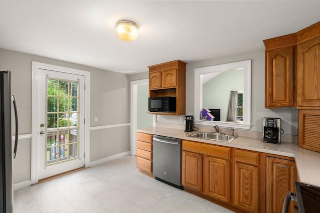 72 Lyall St, Boston, MA 02132 - kitchen featuring stainless steel dishwasher, black microwave, fridge, range, and light countertops