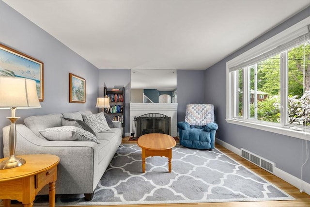 72 Lyall St, Boston, MA 02132 - living area featuring wood finished floors and a fireplace