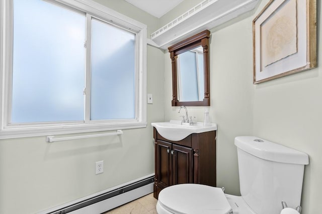 bathroom with baseboard heating, vanity, and toilet