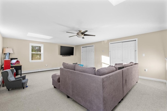 carpeted living room featuring ceiling fan and baseboard heating