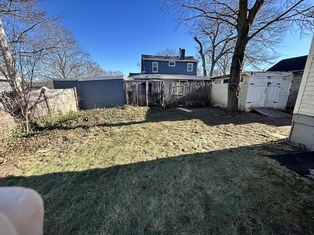 rear view of property featuring a yard