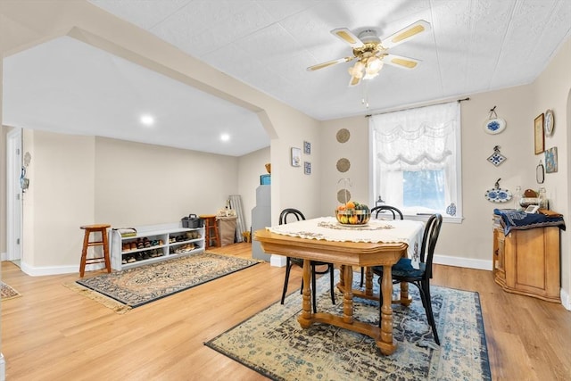 dining room featuring ceiling fan and light hardwood / wood-style floors