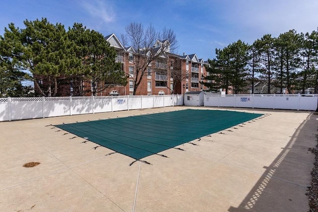 pool featuring a patio and fence