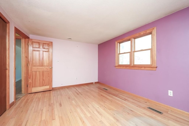 empty room featuring light hardwood / wood-style floors