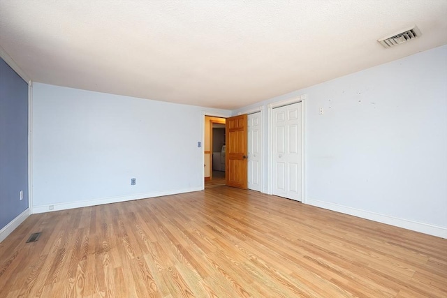 empty room featuring light hardwood / wood-style flooring