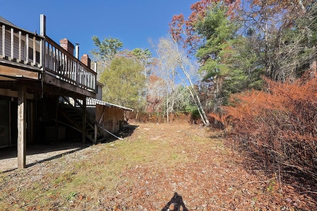 view of yard featuring a wooden deck