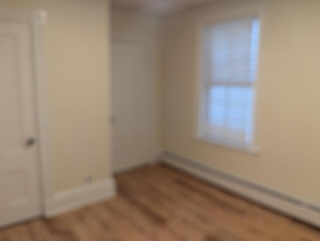 unfurnished room featuring wood finished floors