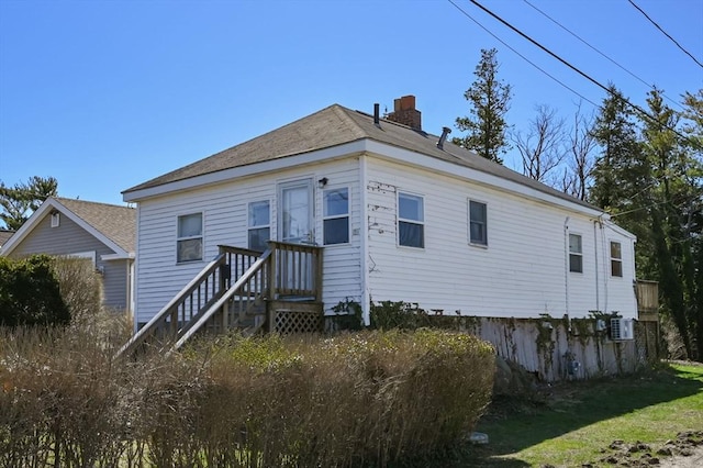 rear view of house with a chimney