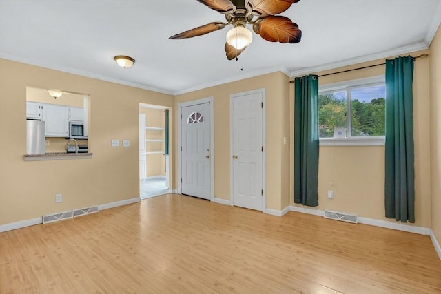 43 Meadowbrook Ln Unit 43, Palmer, MA 01069 - spare room featuring light wood-style floors, crown molding, and a ceiling fan