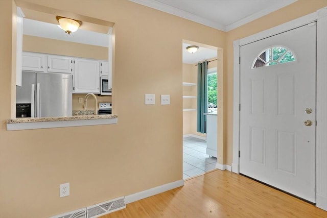 43 Meadowbrook Ln Unit 43, Palmer, MA 01069 - foyer entrance with light wood-type flooring and crown molding