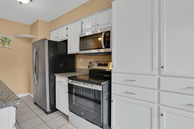 43 Meadowbrook Ln Unit 43, Palmer, MA 01069 - kitchen featuring stainless steel appliances, white cabinetry, light tile patterned floors, and light stone counters