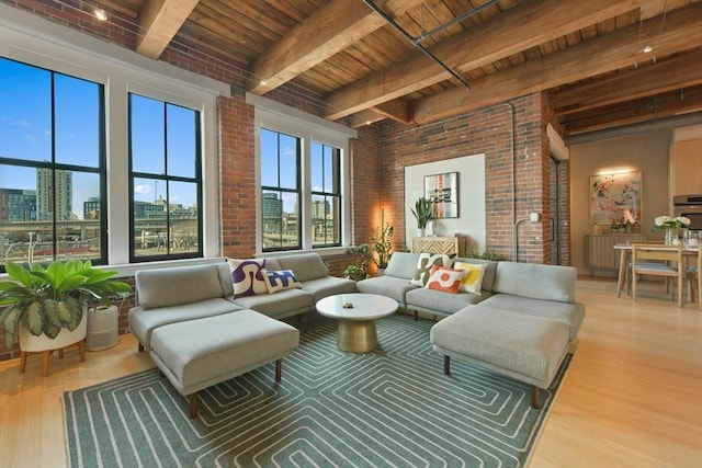 interior space featuring wooden ceiling, brick wall, a view of city, and wood finished floors