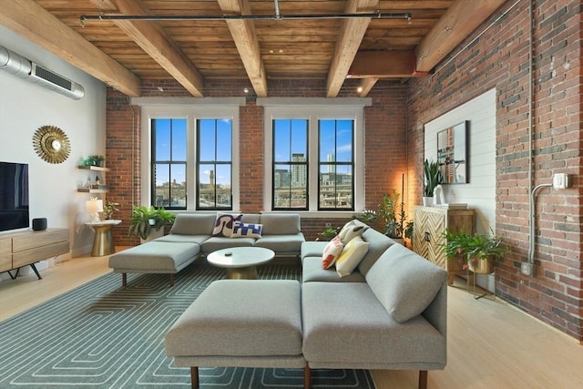 living room with brick wall, wood ceiling, and beamed ceiling