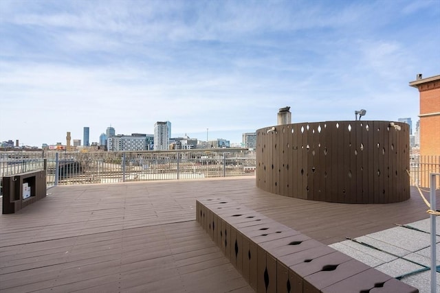 wooden deck with a view of city
