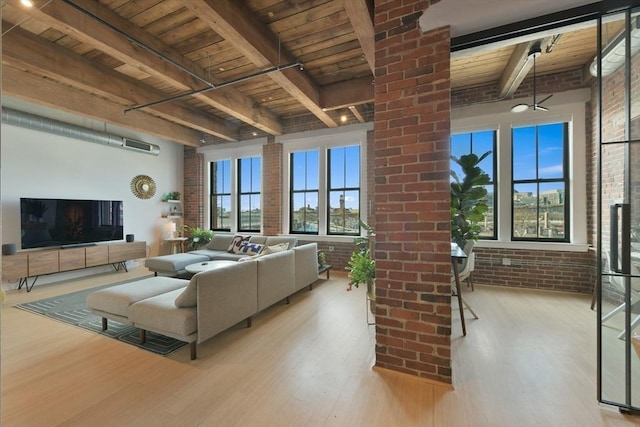 living room with brick wall, wood finished floors, and wood ceiling