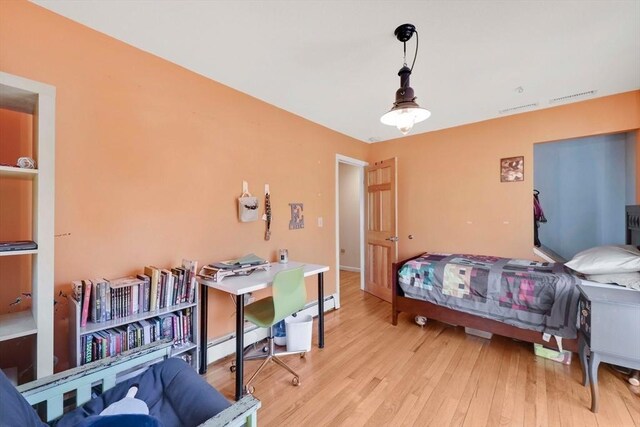 bedroom with light wood-type flooring