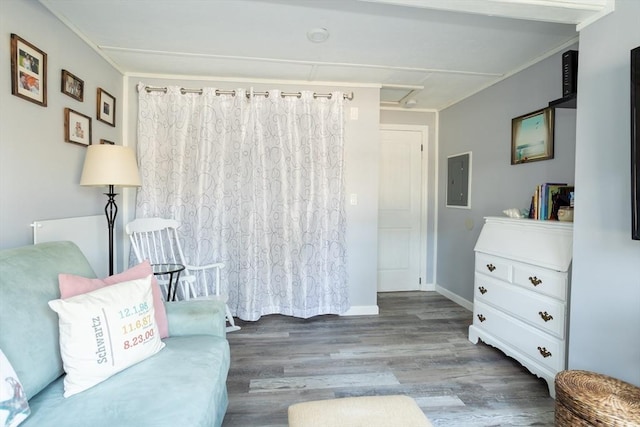 1 Ladd Ave, Wareham, MA 02571 - sitting room with wood finished floors, electric panel, crown molding, and attic access