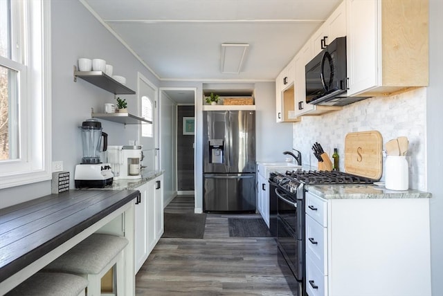 1 Ladd Ave, Wareham, MA 02571 - kitchen with appliances with stainless steel finishes, open shelves, white cabinetry, backsplash, and crown molding