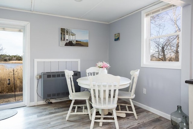 1 Ladd Ave, Wareham, MA 02571 - dining area featuring ornamental molding, wood finished floors, plenty of natural light, heating unit, and baseboards