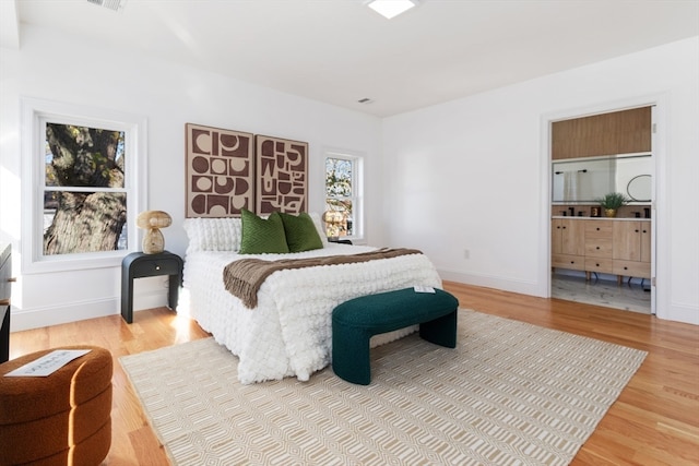 bedroom with wood-type flooring