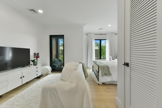 50 Leo M Birmingham Pkwy Unit 405, Boston, MA 02135 - bedroom featuring light wood-style floors and recessed lighting