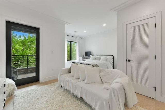 50 Leo M Birmingham Pkwy Unit 405, Boston, MA 02135 - bedroom featuring access to exterior, light wood finished floors, recessed lighting, and baseboards