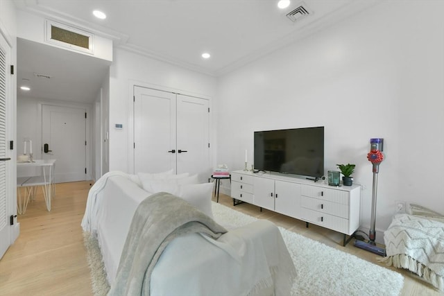 50 Leo M Birmingham Pkwy Unit 405, Boston, MA 02135 - bedroom with light wood finished floors, ornamental molding, recessed lighting, and a closet