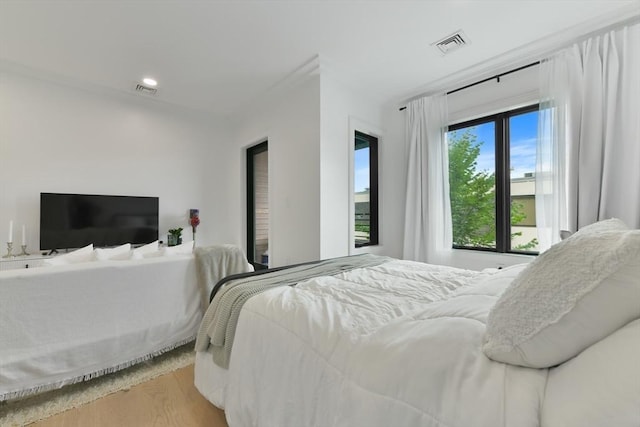 50 Leo M Birmingham Pkwy Unit 405, Boston, MA 02135 - bedroom featuring wood finished floors and recessed lighting