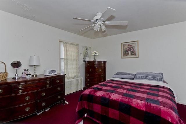 bedroom with ceiling fan and radiator heating unit