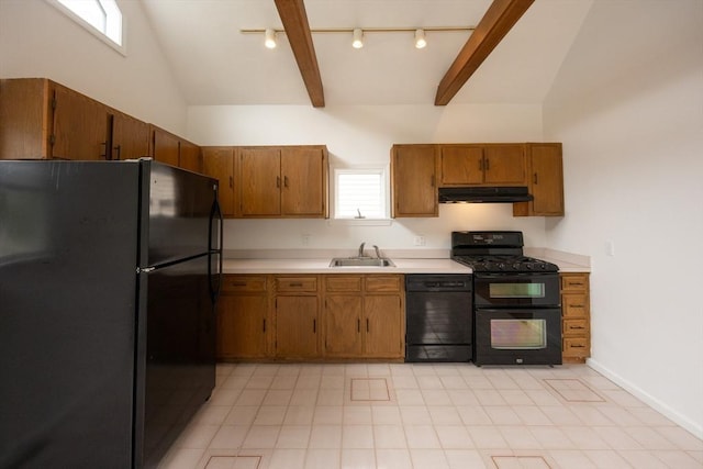 27 Union St Unit 27, Natick, MA 01760 - kitchen featuring black appliances, under cabinet range hood, rail lighting, light countertops, and brown cabinetry