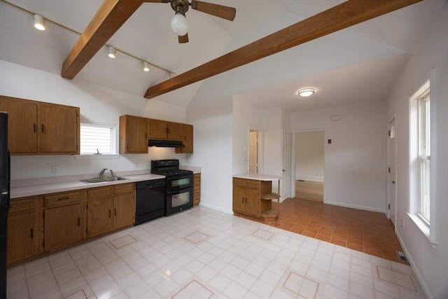 27 Union St Unit 27, Natick, MA 01760 - kitchen featuring black appliances, rail lighting, light countertops, brown cabinetry, and under cabinet range hood
