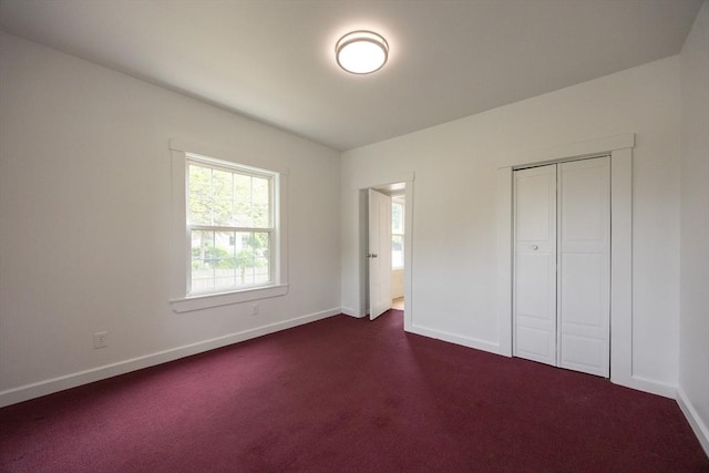 27 Union St Unit 27, Natick, MA 01760 - unfurnished bedroom with baseboards and dark colored carpet