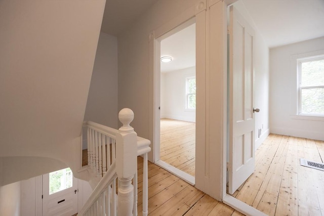 27 Union St Unit 27, Natick, MA 01760 - corridor featuring an upstairs landing, light wood-type flooring, and plenty of natural light