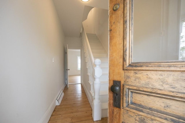 27 Union St Unit 27, Natick, MA 01760 - hall with light wood-style floors, baseboard heating, healthy amount of natural light, and vaulted ceiling