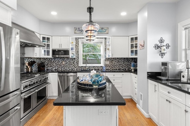 1 W Cliff St, Nahant, MA 01908 - kitchen featuring stainless steel appliances, dark countertops, light wood-style floors, open shelves, and recessed lighting
