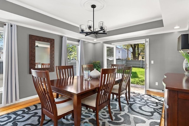 1 W Cliff St, Nahant, MA 01908 - dining area with a chandelier, baseboards, light wood-type flooring, crown molding, and a tray ceiling