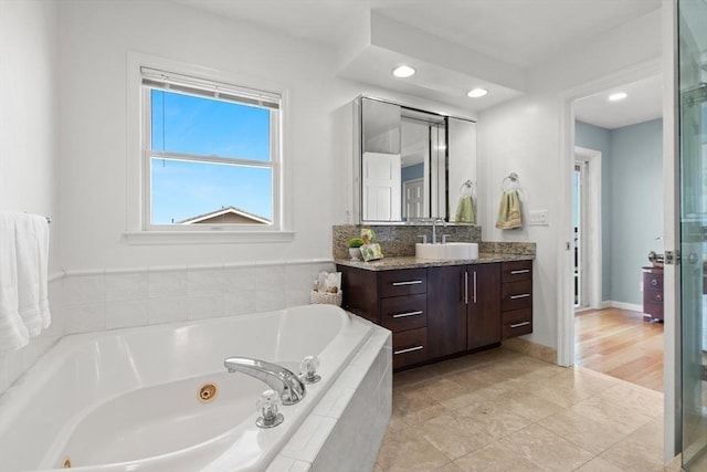 1 W Cliff St, Nahant, MA 01908 - full bath featuring vanity, a tub with jets, recessed lighting, tile patterned floors, and baseboards