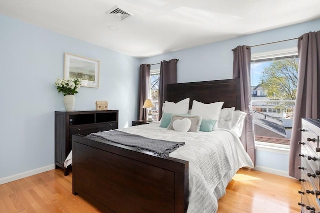 1 W Cliff St, Nahant, MA 01908 - bedroom with light wood-style flooring, baseboards, and multiple windows