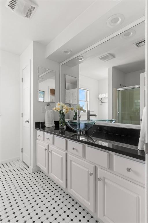 1 W Cliff St, Nahant, MA 01908 - full bath with vanity, a shower stall, tile patterned floors, and baseboards