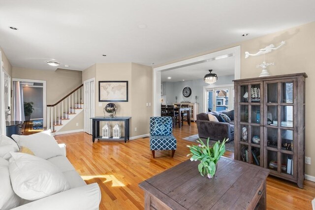 1 W Cliff St, Nahant, MA 01908 - living area with light wood finished floors, stairs, and baseboards