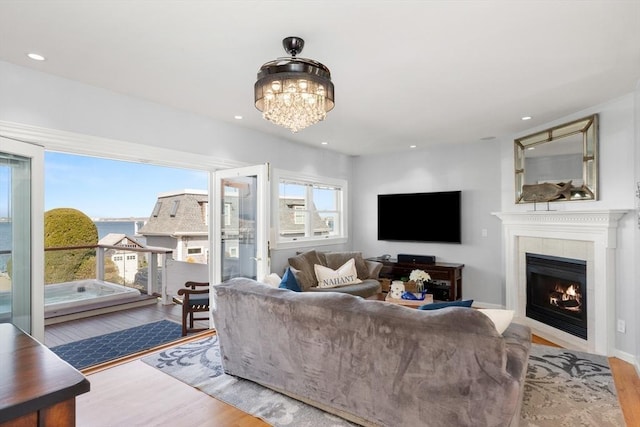 1 W Cliff St, Nahant, MA 01908 - living room with wood finished floors, a tile fireplace, a chandelier, and recessed lighting