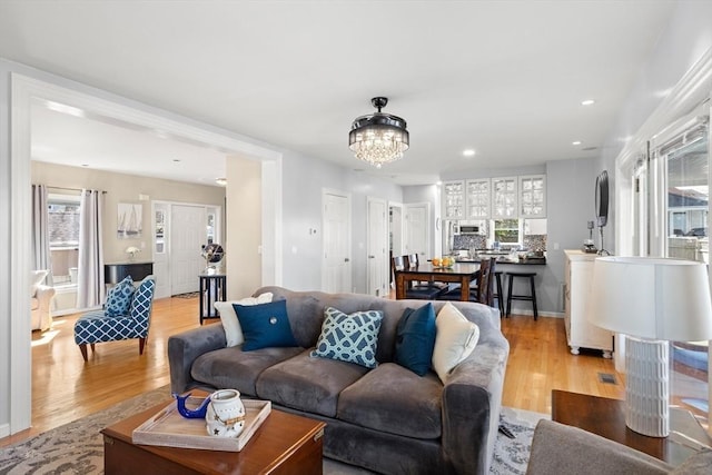 1 W Cliff St, Nahant, MA 01908 - living room featuring light wood-type flooring, a chandelier, and recessed lighting