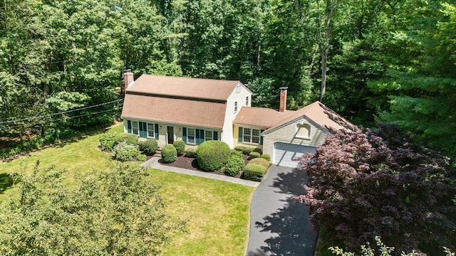 11 Laurel Dr, Scituate, MA 02066 - dutch colonial featuring driveway, a chimney, a front yard, a gambrel roof, and an attached garage
